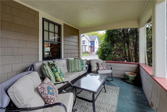 view of patio featuring covered porch and outdoor lounge area
