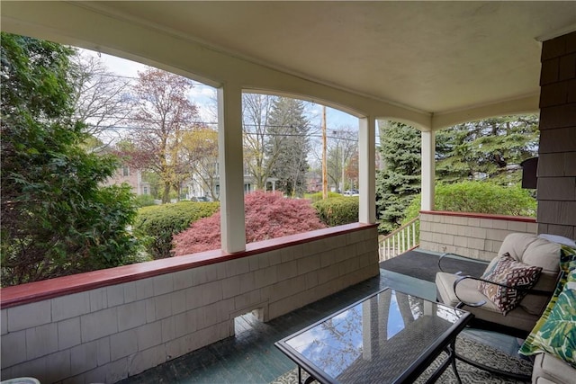 sunroom / solarium with wood finished floors