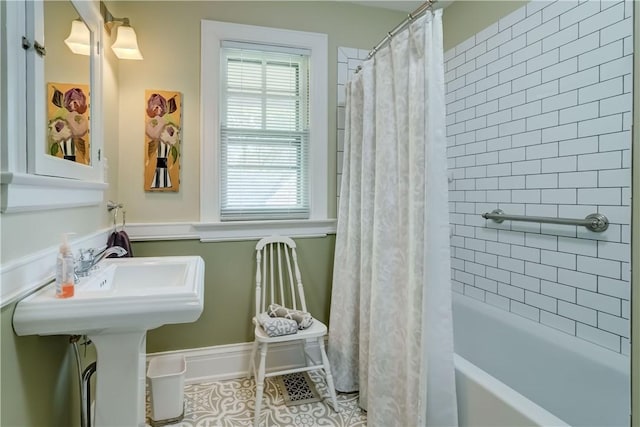bathroom featuring tile patterned floors and shower / bath combo with shower curtain