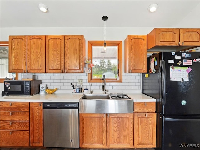742 Centerline Rd, Sheldon, NY 14145 - kitchen with black appliances, a sink, light countertops, backsplash, and brown cabinets