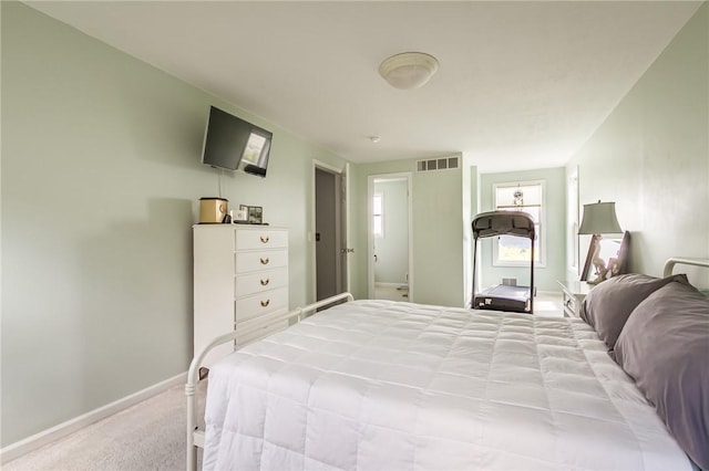 carpeted bedroom with baseboards