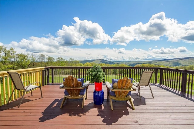wooden deck featuring a mountain view