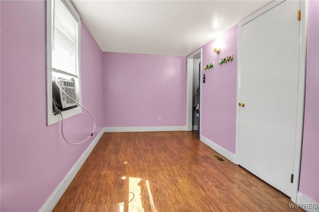 165 Breckenridge St, Buffalo, NY 14213 - unfurnished room with wood finished floors, baseboards, and cooling unit