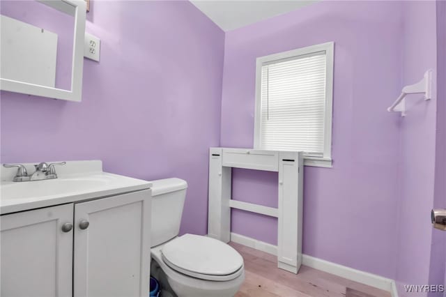 165 Breckenridge St, Buffalo, NY 14213 - half bath with wood finished floors, toilet, vanity, and baseboards