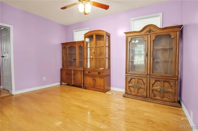 165 Breckenridge St, Buffalo, NY 14213 - unfurnished dining area with a ceiling fan, light wood finished floors, and baseboards