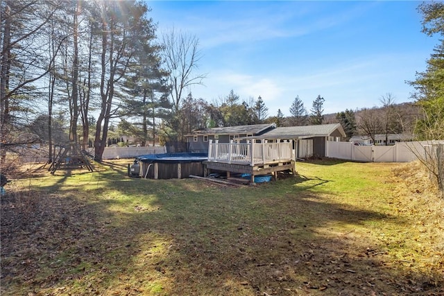 view of yard with a wooden deck