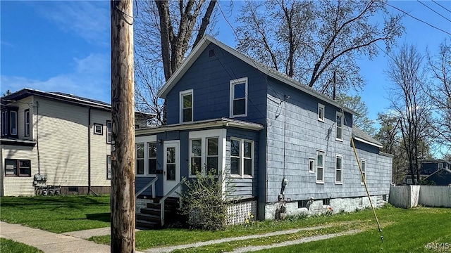 view of side of property featuring a yard