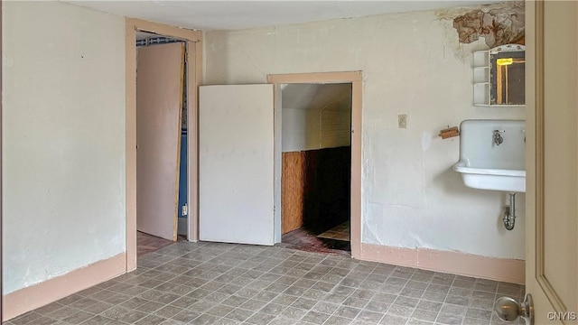 unfurnished bedroom with a sink