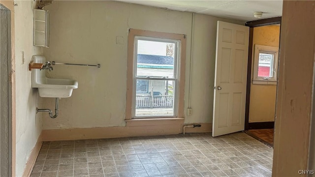 spare room featuring a sink and a smoke detector