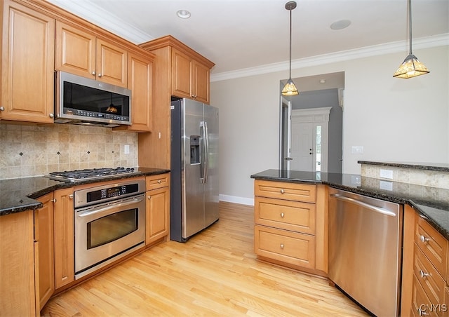 100 Brandywine Dr, Manlius, NY 13104 - kitchen featuring appliances with stainless steel finishes, ornamental molding, backsplash, light wood finished floors, and decorative light fixtures