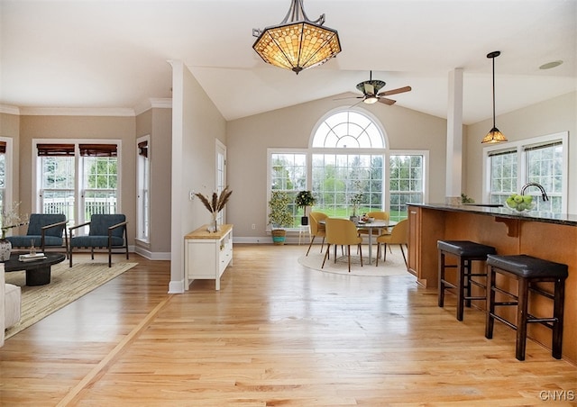 100 Brandywine Dr, Manlius, NY 13104 - dining room with light wood-style flooring, a ceiling fan, lofted ceiling, and baseboards