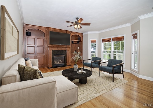 100 Brandywine Dr, Manlius, NY 13104 - living area with crown molding, wood finished floors, a ceiling fan, baseboards, and a fireplace with flush hearth