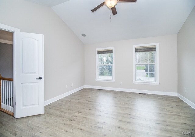 100 Brandywine Dr, Manlius, NY 13104 - unfurnished room featuring lofted ceiling, a ceiling fan, wood finished floors, and baseboards