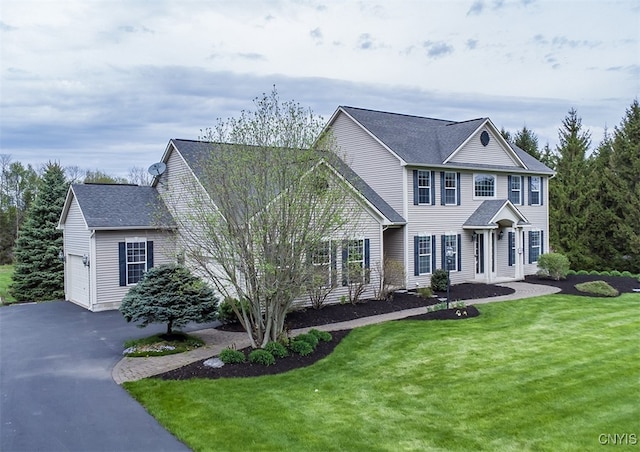 100 Brandywine Dr, Manlius, NY 13104 - colonial home with a front yard, asphalt driveway, an attached garage, and a shingled roof