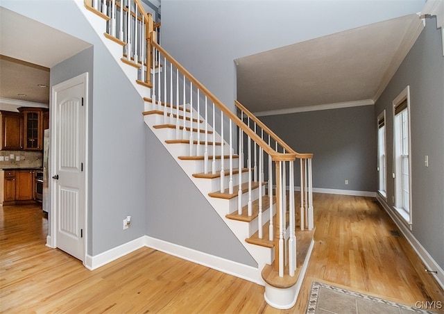 100 Brandywine Dr, Manlius, NY 13104 - staircase with crown molding, wood finished floors, and baseboards