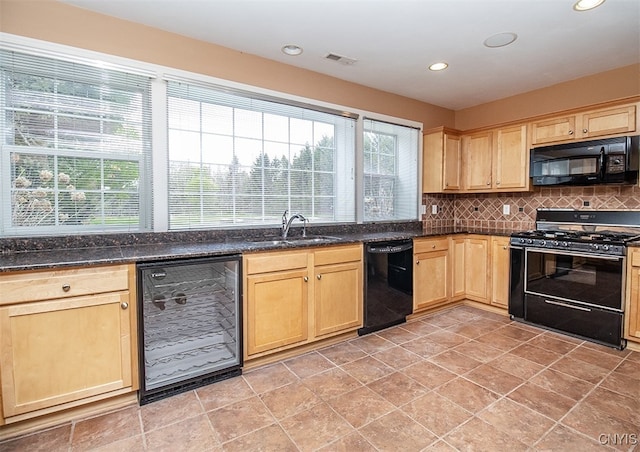 100 Brandywine Dr, Manlius, NY 13104 - kitchen with black appliances, a sink, light brown cabinetry, beverage cooler, and tasteful backsplash