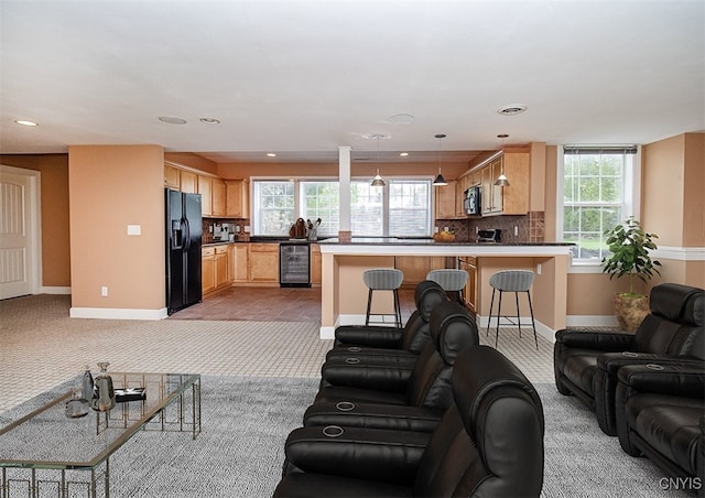 100 Brandywine Dr, Manlius, NY 13104 - living room featuring light colored carpet, baseboards, plenty of natural light, and recessed lighting