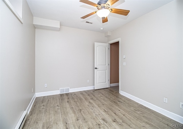 100 Brandywine Dr, Manlius, NY 13104 - empty room featuring a baseboard heating unit, light wood finished floors, a ceiling fan, and baseboards