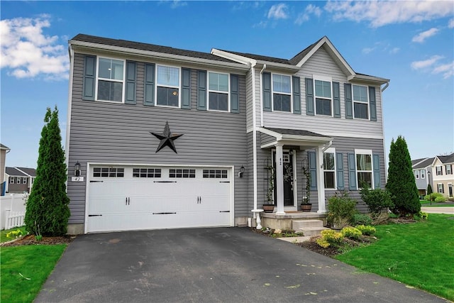 view of front facade featuring an attached garage and driveway