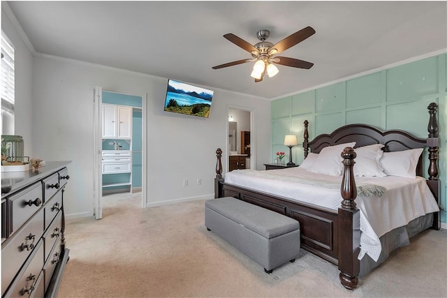 bedroom with light carpet, ornamental molding, baseboards, connected bathroom, and a ceiling fan