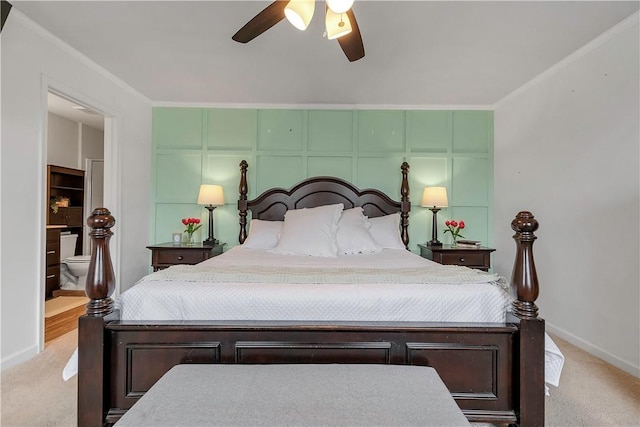 carpeted bedroom featuring baseboards, ornamental molding, and ceiling fan
