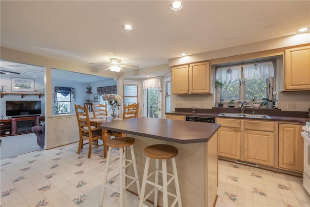 8 Hawkes Trl, Penfield, NY 14580 - kitchen with dark countertops, light brown cabinetry, ceiling fan, a sink, and light floors