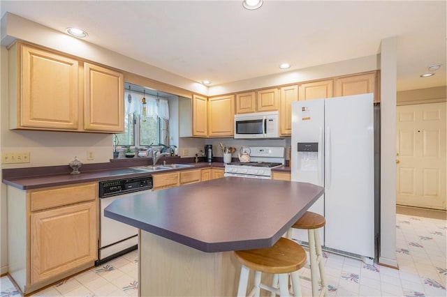 8 Hawkes Trl, Penfield, NY 14580 - kitchen with white appliances, light brown cabinets, dark countertops, a breakfast bar area, and recessed lighting