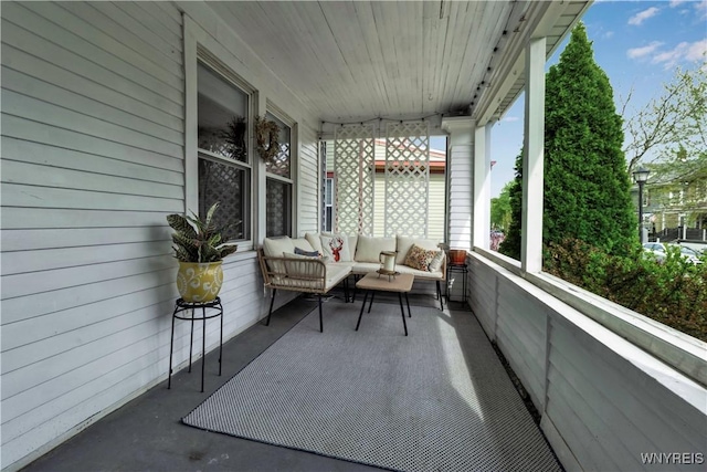 view of patio with an outdoor hangout area and covered porch