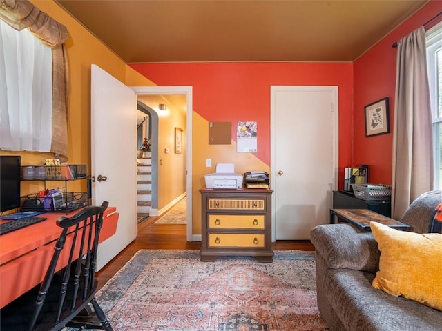 office area featuring wood finished floors and baseboards