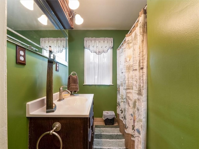 bathroom featuring vanity and a shower with curtain