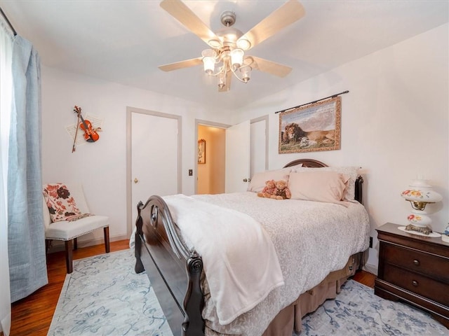 bedroom featuring wood finished floors and a ceiling fan