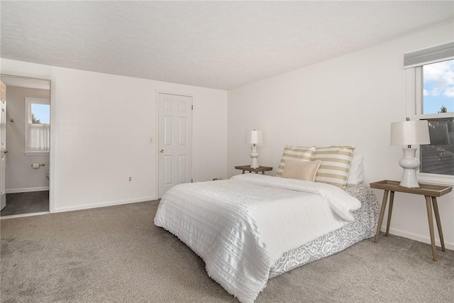 bedroom with carpet and baseboards