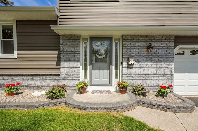 property entrance with brick siding