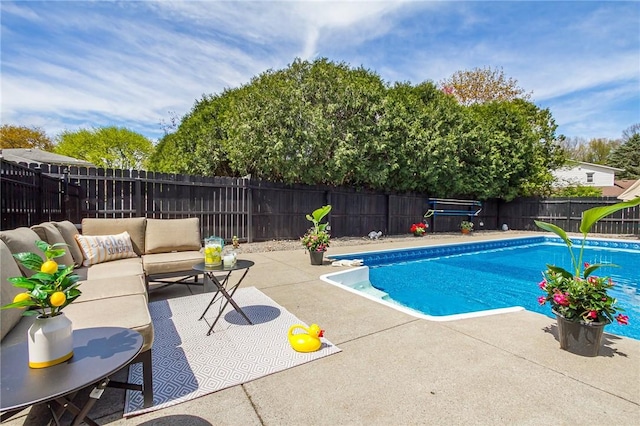 view of swimming pool with a patio area, a fenced backyard, and an outdoor hangout area