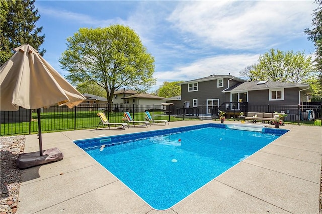 view of swimming pool featuring a patio and a deck