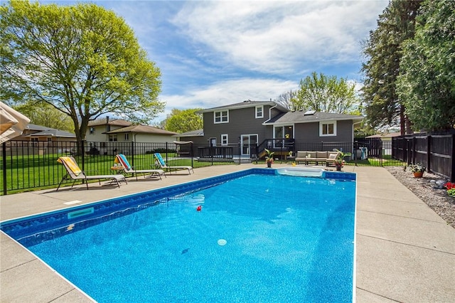 view of pool featuring a wooden deck and a patio area