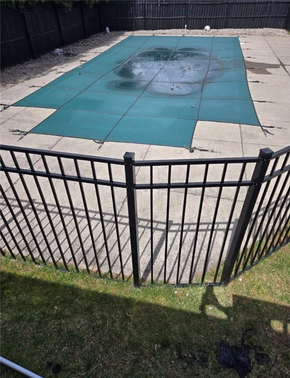 view of swimming pool featuring a fenced backyard