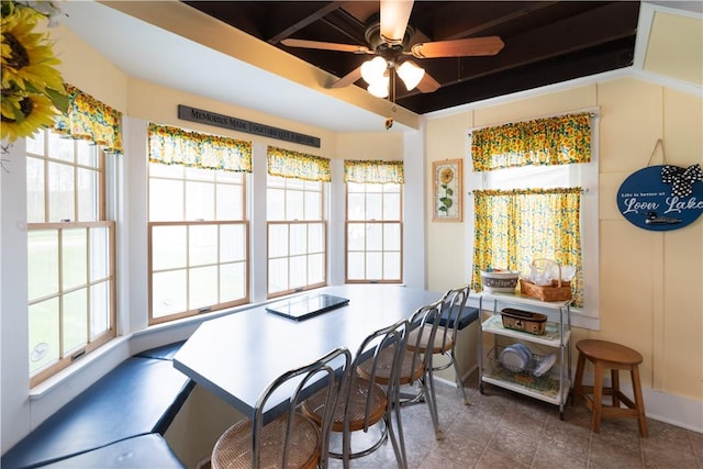 tiled dining space featuring ceiling fan