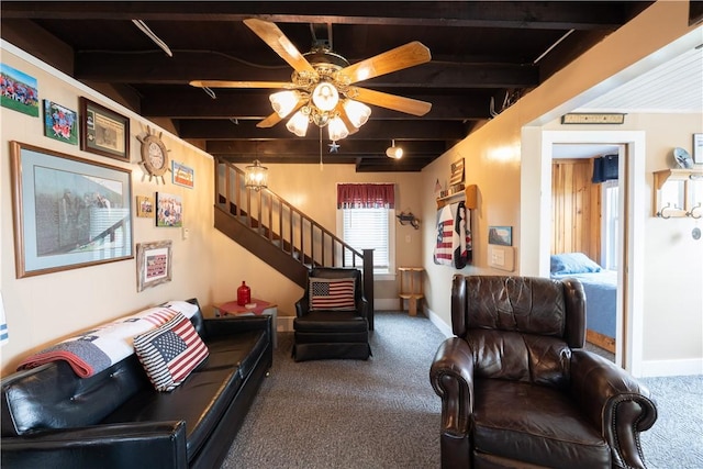carpeted living room with stairway, ceiling fan, beam ceiling, and baseboards