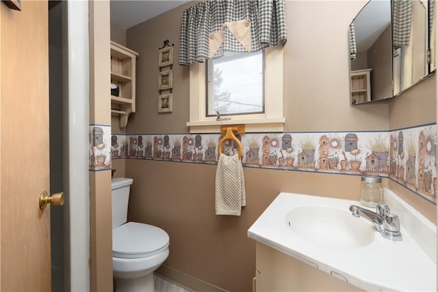 bathroom with toilet and vanity