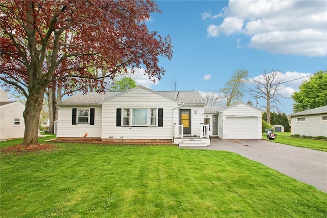 ranch-style home with an attached garage, asphalt driveway, and a front lawn