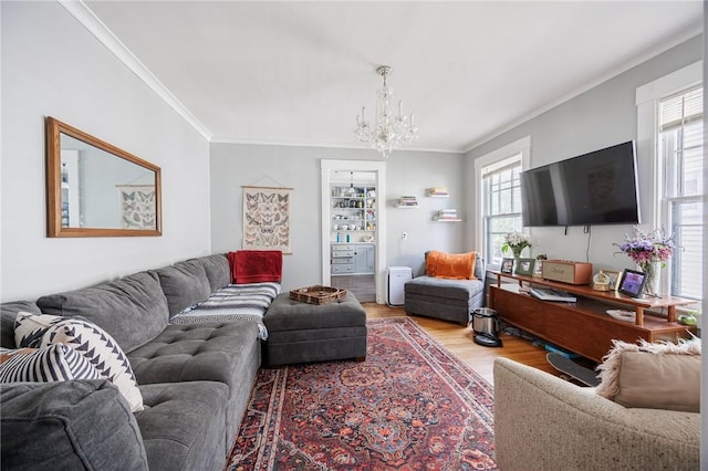 45 Juniper St, Rochester, NY 14610 - living area with wood finished floors, a chandelier, and crown molding