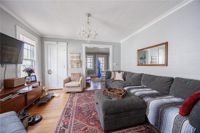 45 Juniper St, Rochester, NY 14610 - living area with a chandelier, plenty of natural light, wood finished floors, and crown molding