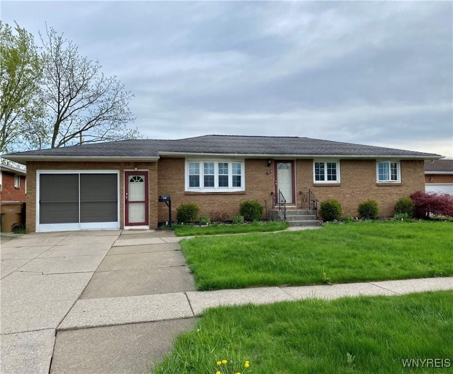 99 Frantzen, Cheektowaga, NY 14227 - single story home featuring concrete driveway, an attached garage, brick siding, a front yard, and entry steps