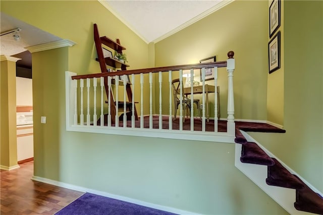 staircase featuring crown molding, baseboards, and wood finished floors
