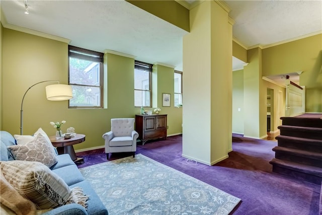 carpeted living room with crown molding, baseboards, and stairs