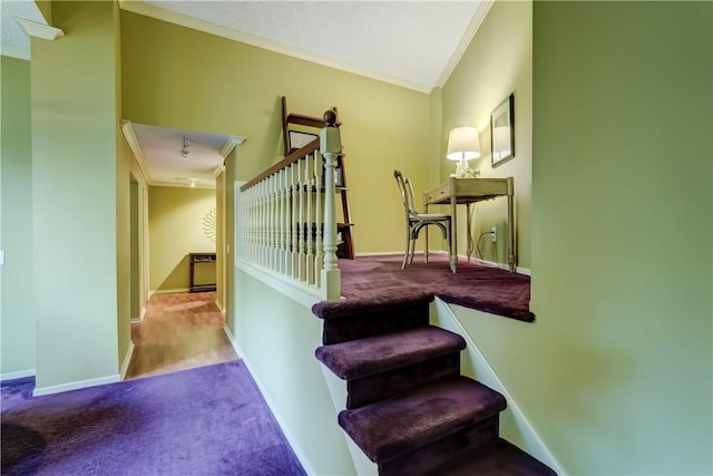 stairs featuring ornamental molding, carpet flooring, and baseboards