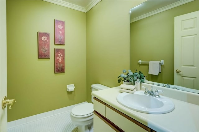 bathroom with toilet, crown molding, vanity, and tile patterned floors