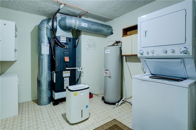 clothes washing area featuring stacked washer / drying machine, water heater, light flooring, and a textured ceiling