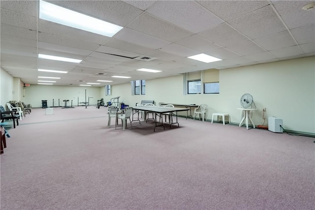 game room featuring carpet flooring and a drop ceiling